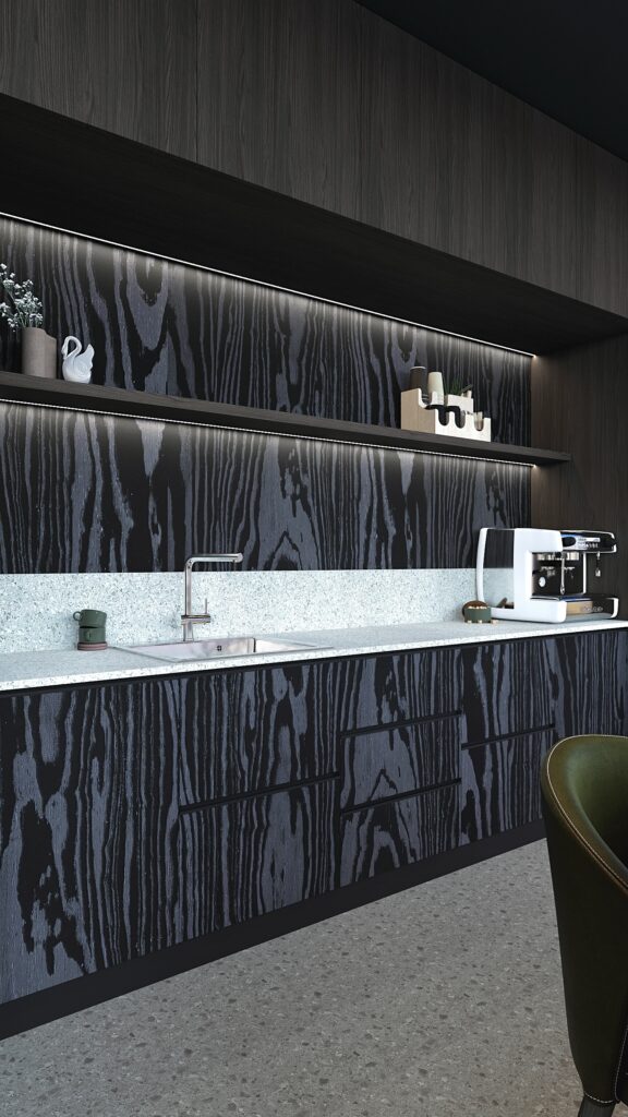 Bucătărie office modernă Oradea cu insulă de metal inox scaune verzi și pardoseală terrazzo design Fabiano Interiors. Amenajare realizată de Fabiano Interiors, expert design interior Oradea.