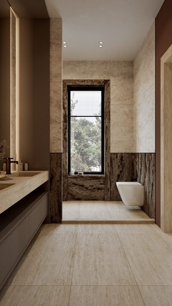 Baie modernă cu duș walk-in, finisaje din piatră naturală, lavoar suspendat și oglindă iluminată ambiental Amenajare realizată de Fabiano Interiors, expert design interior Oradea.
