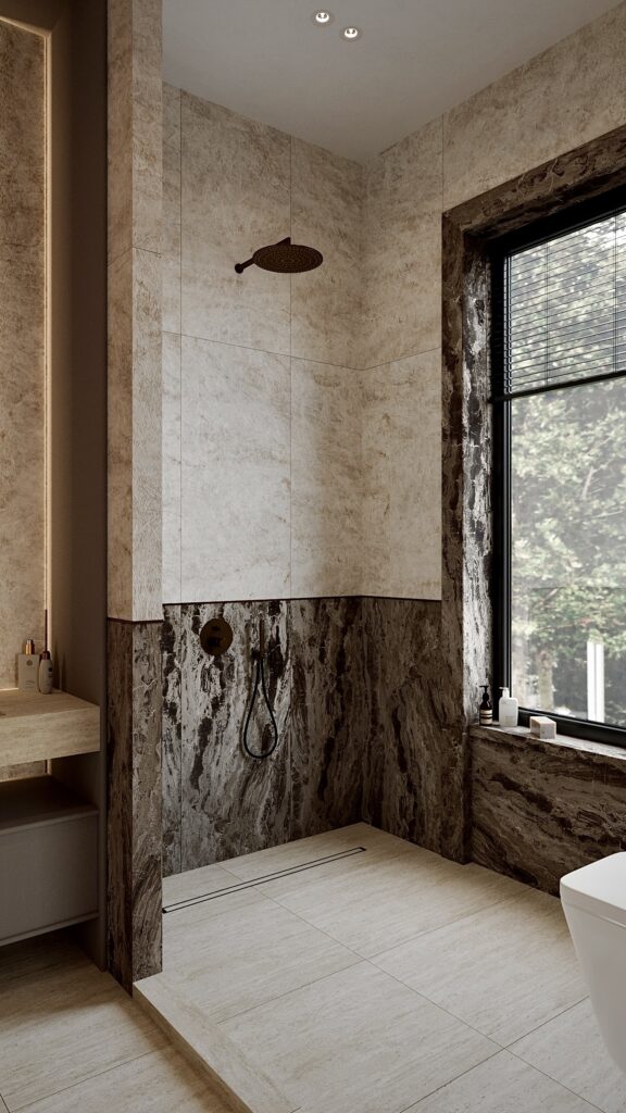 Design interior baie contemporană cu placări din piatră, duș deschis și mobilier suspendat minimalist Amenajare realizată de Fabiano Interiors, expert design interior Oradea.