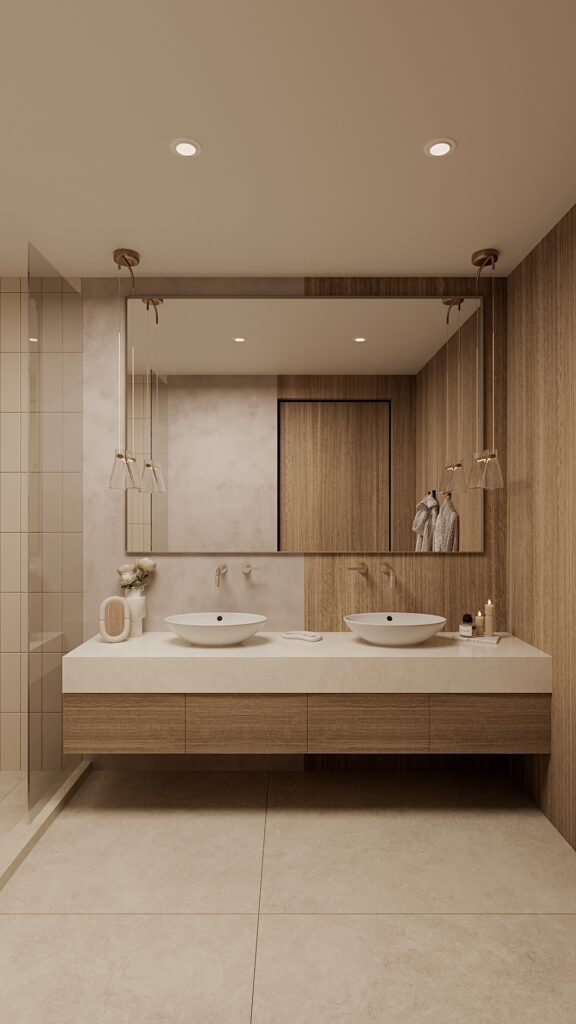 Baie modernă cu lavoare duble pe blat alb, mobilier suspendat din lemn, oglindă mare și pendule din sticlă, design interior minimalist în tonuri de bej. Amenajare realizată de Fabiano Interiors, expert design interior Oradea.