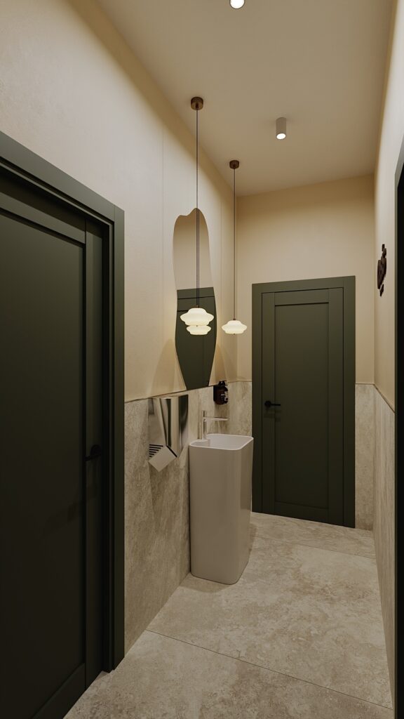 Amenajare spațiu sanitar comercial realizată de Fabiano Interiors, un proiect de design interior în Oradea caracterizat prin nuanțe calde de bej, uși elegante verde închis, oglindă decorativă fluidă, corpuri de iluminat elegante suspendate și placări ceramice stil travertin pentru un ambient relaxant.